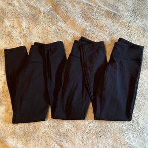 three pairs of lululemon black leggings